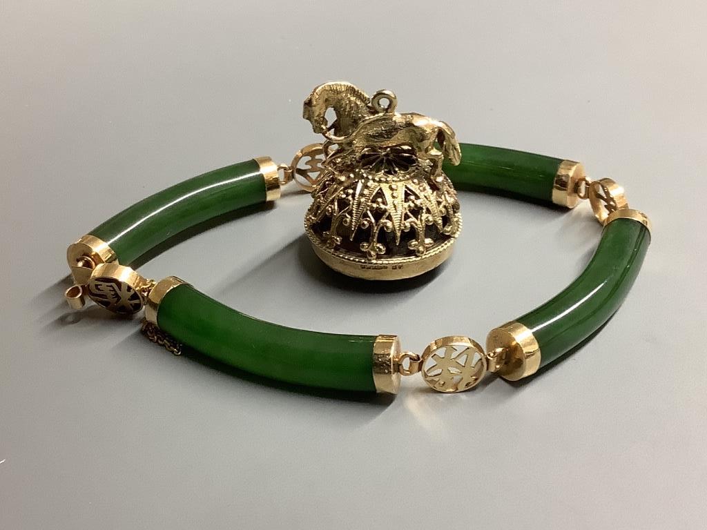 A modern 14 K yellow metal and nephrite set bracelet and a modern 9 carat gold and quartz set fob seal.